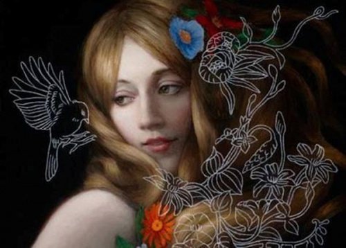 Vogel landet auf der Schulter einer Frau
